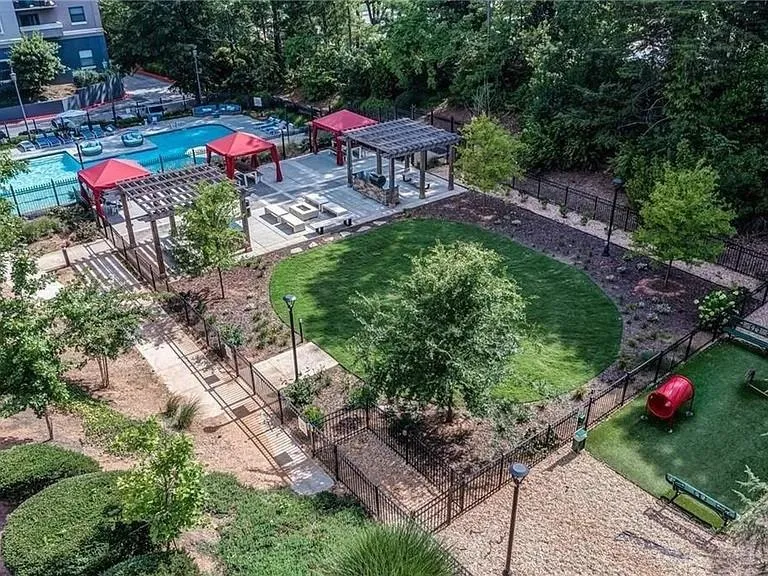 Drone / aerial view of a pool and a recreational park