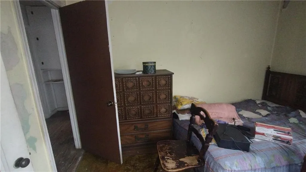 Bedroom with dark wood finished floors
