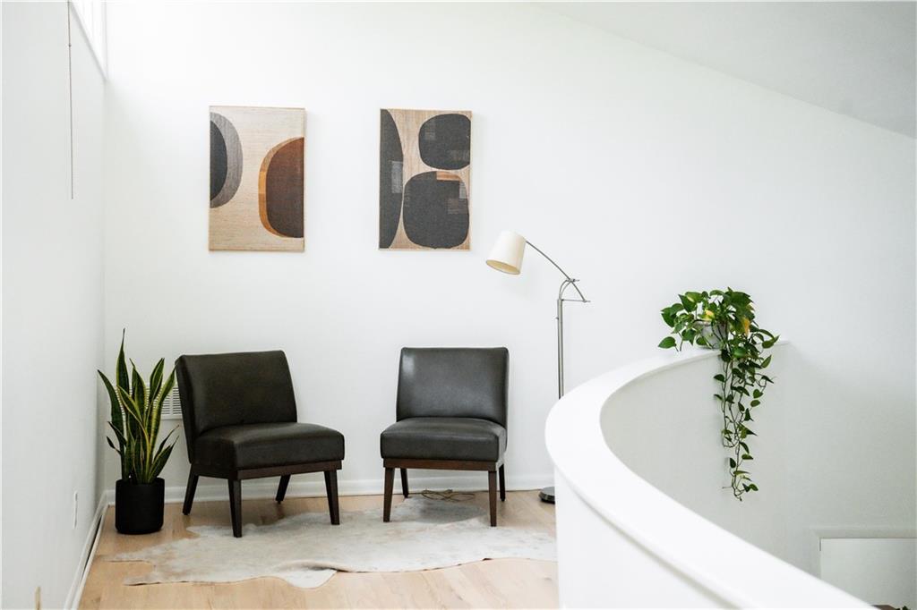 Living area with light hardwood / wood-style flooring