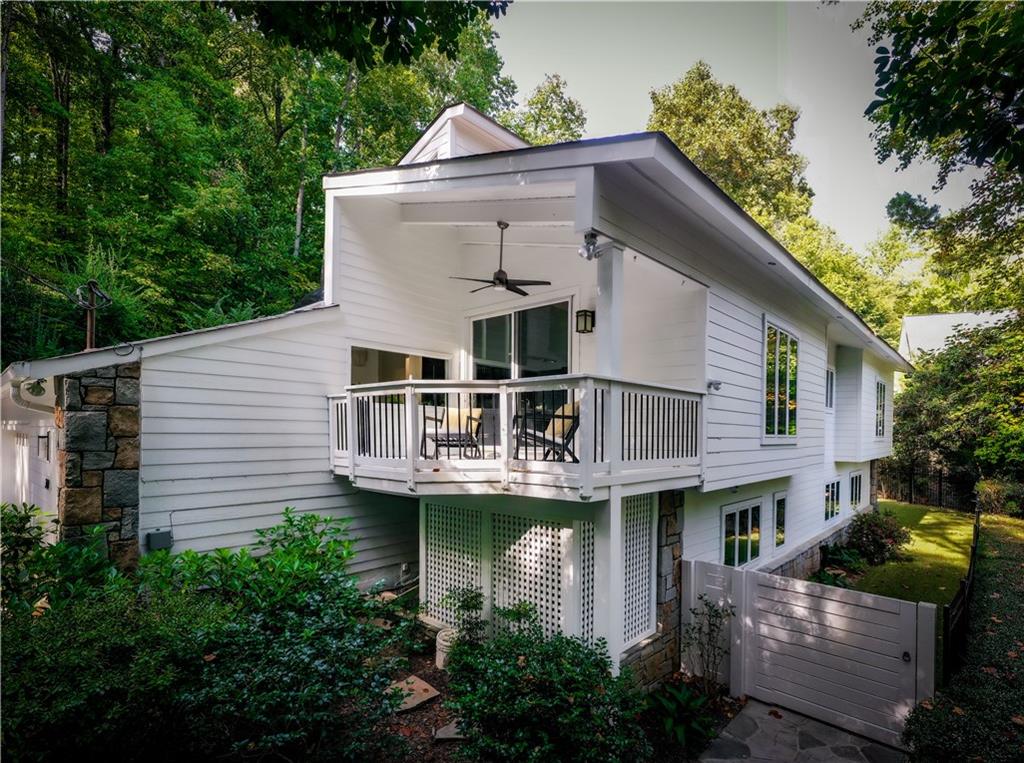 Rear view of property featuring a deck