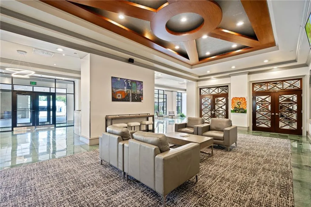 Community lobby with ornamental molding and recessed lighting