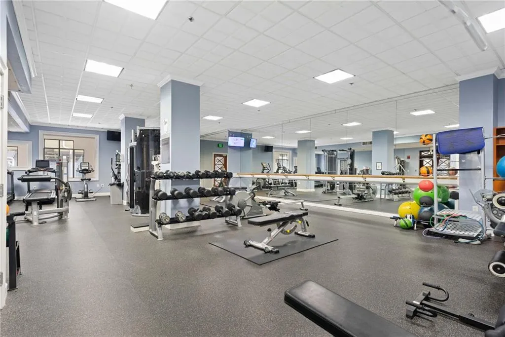 Gym with a paneled ceiling