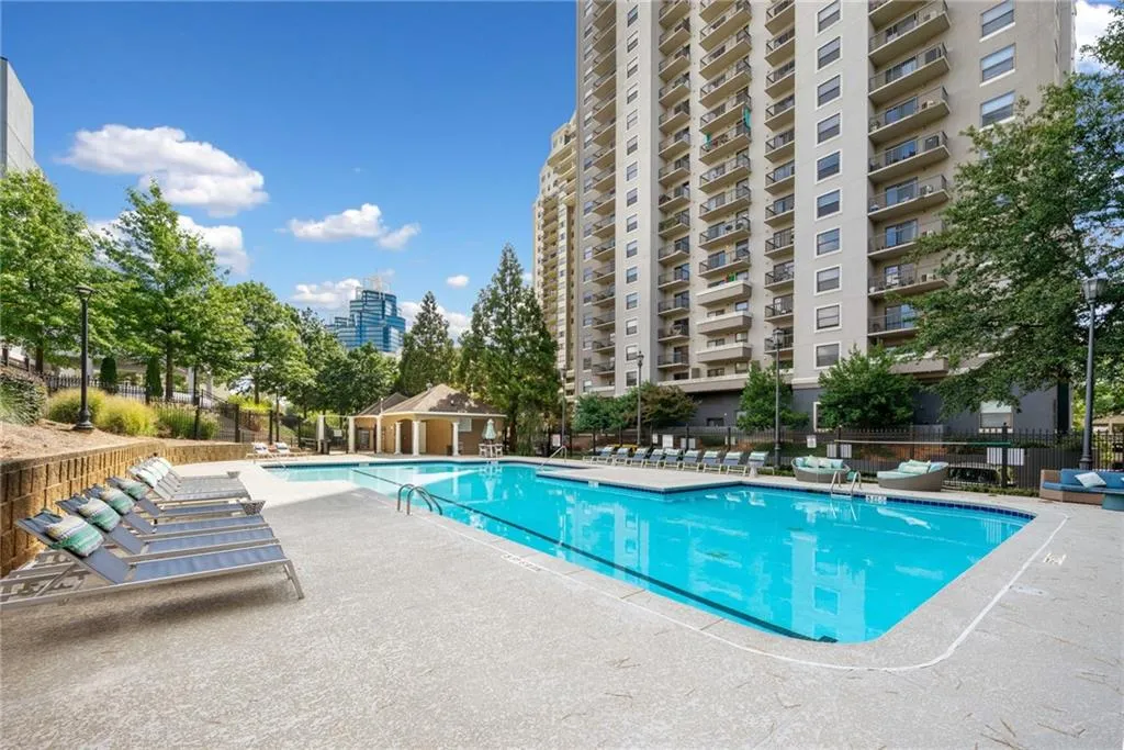Community pool with a patio