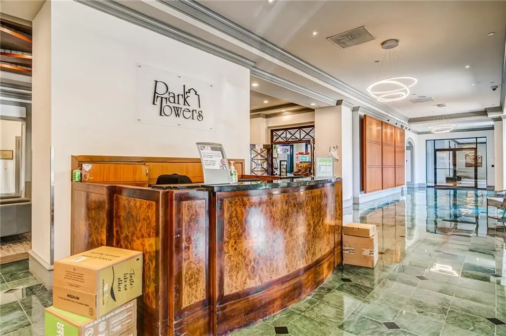 Reception with a bar, a chandelier, and ornamental molding