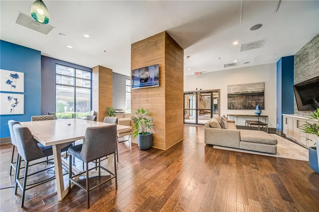 Dining area with wood-type flooring and recessed lighting