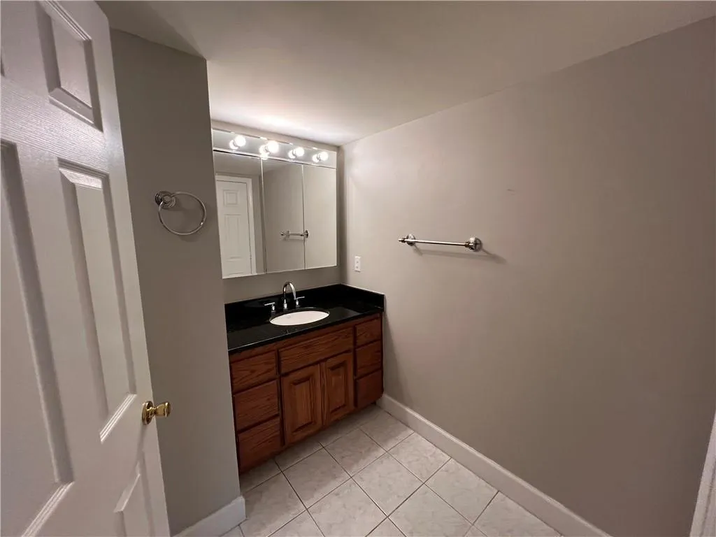 Bathroom with vanity and tile patterned floors