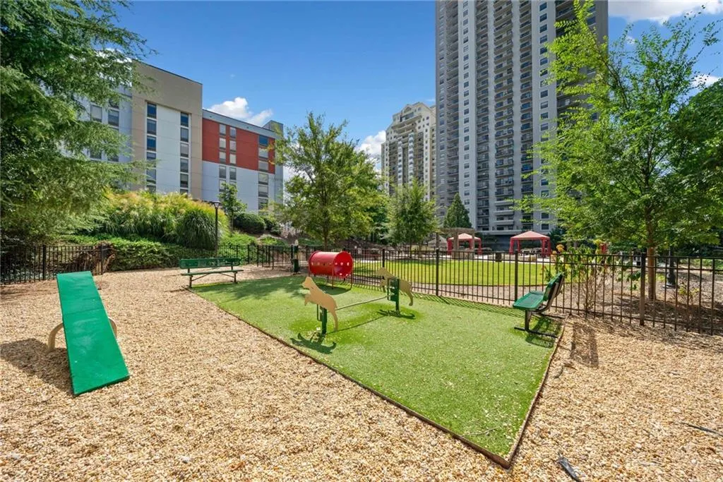 View of community with a dog friendly area and heating fuel