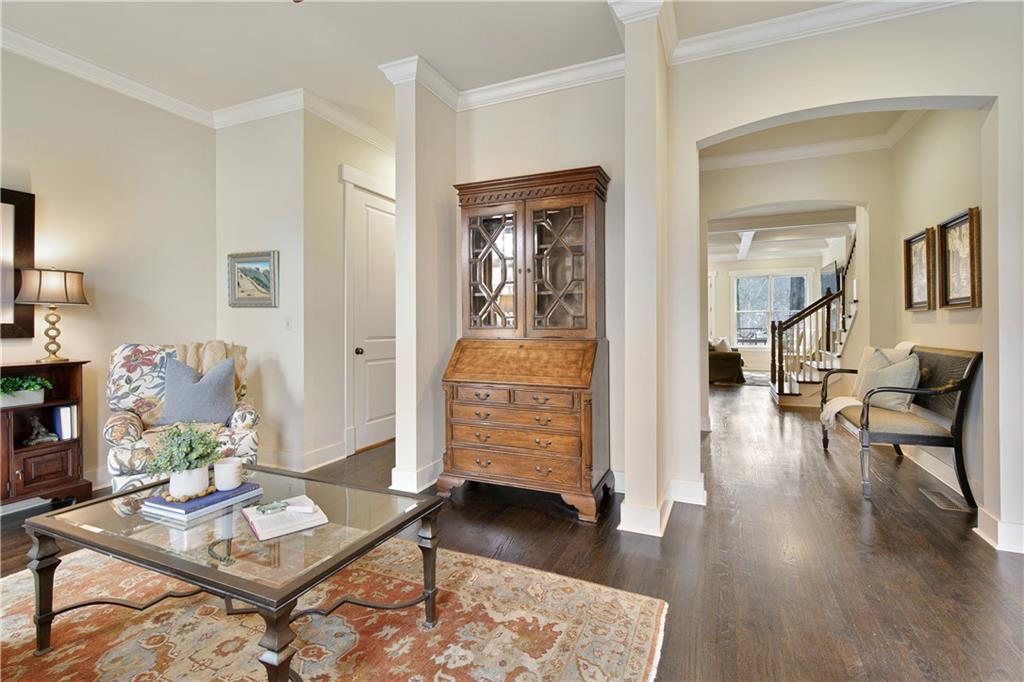 The formal living room flows to the open concept entertaining area of the home.