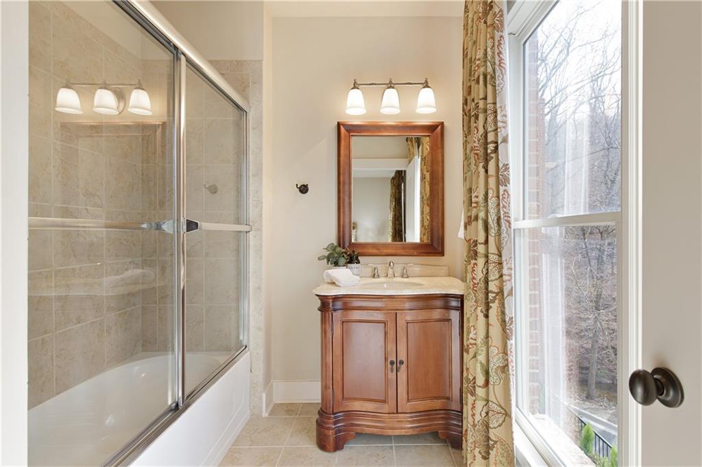 The ensuite bathroom attached to the secondary bedroom, designed for privacy and convenience. This well-appointed space is complete with modern fixtures and finishes, offering a comfortable and functional area for daily routines.