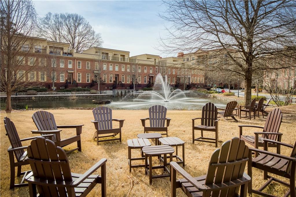 One River Place is a gated community spanning 33 acres, characterized by lush green spaces, a serene pond, and a variety of amenities.