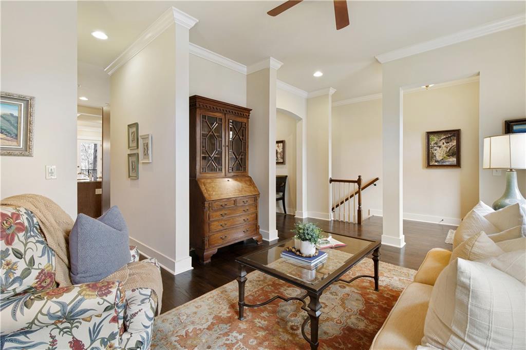 A main level powder room is adjacent to the formal living room and stairs ascend to the terrace level and garage.