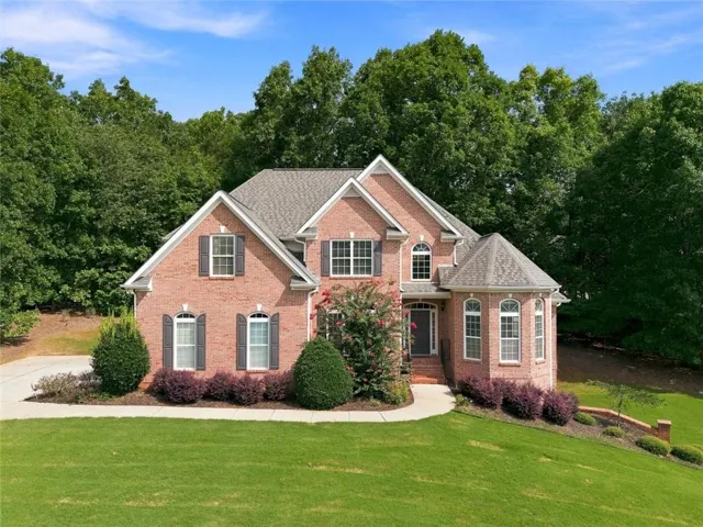 Traditional brick exterior with an arched entry and a turret-style architectural element