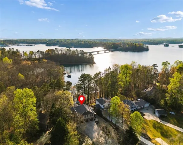 Waterfront property with a multi-level structure and attached garage