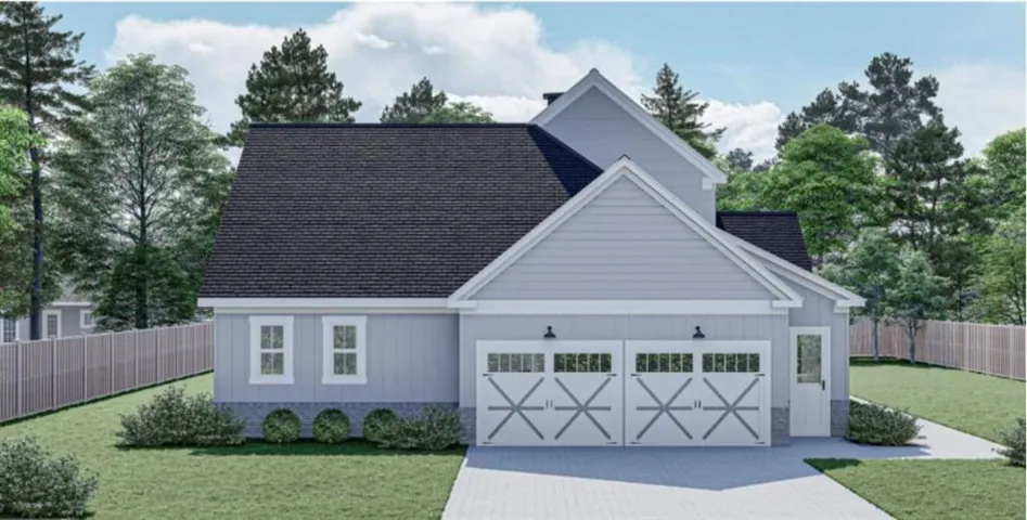 View of front of property with roof with shingles, driveway, and a garage