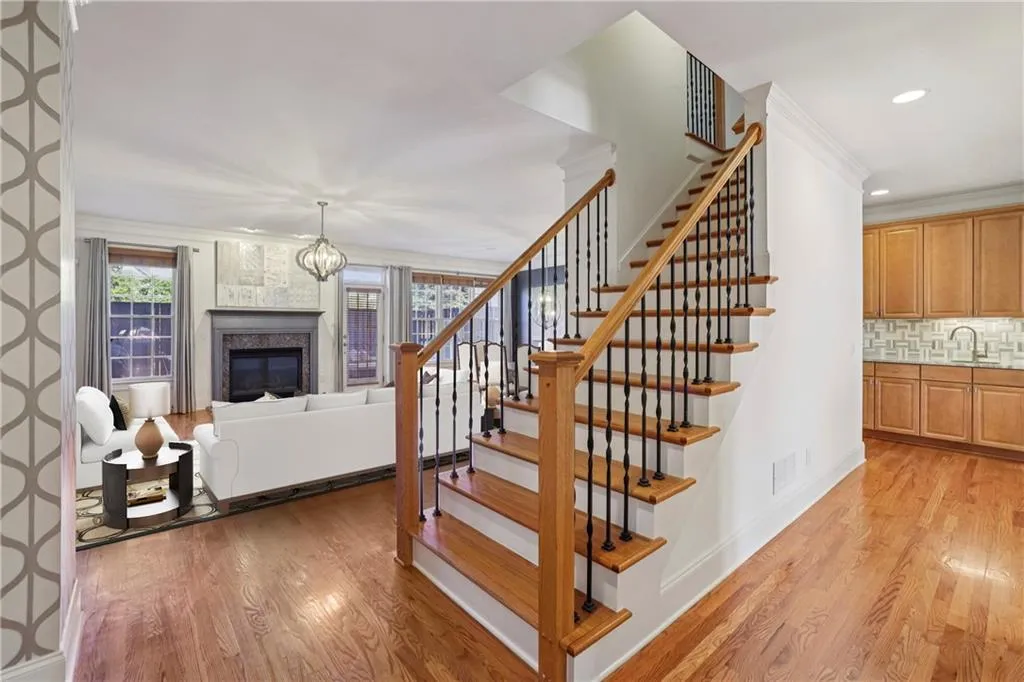 Main level with family room in background and kitchen area to the right. 9' ceiling height makes all the rooms seem that much bigger than they are.