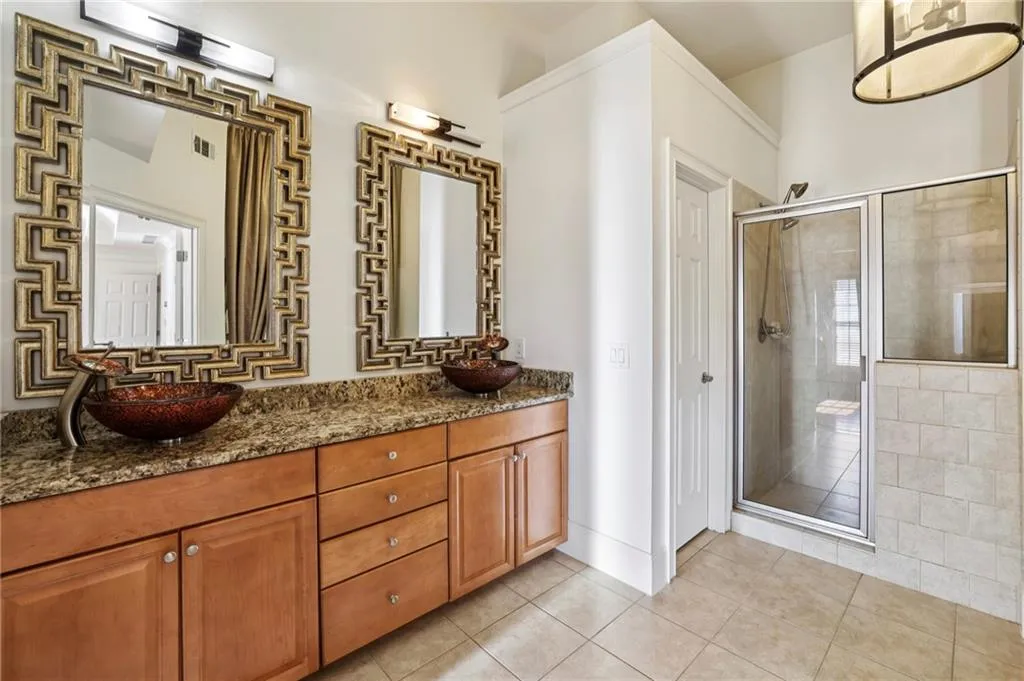 Primary bedroom bath with separate shower and soaking tub.