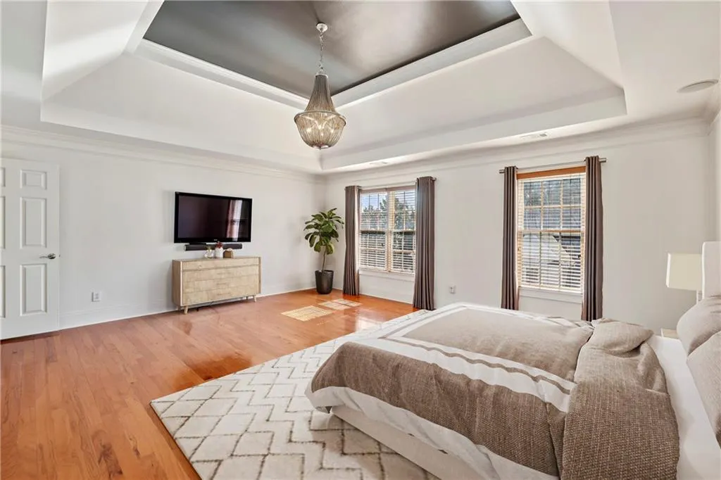 Primary bedroom. Large windows allows natural sunlight to fill the room.