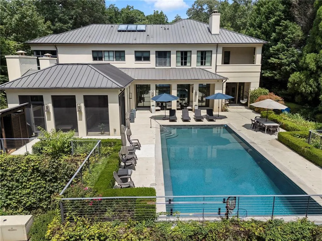The house wraps around a walk out pool with pool bath.