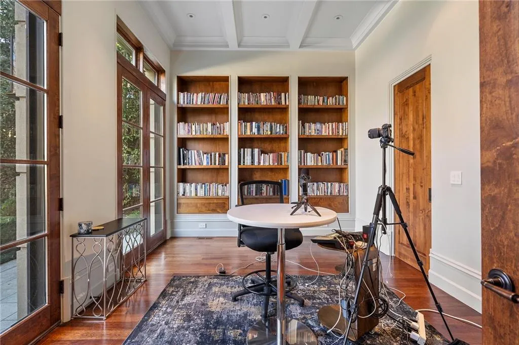 Solid wood doors open out to the gardens.