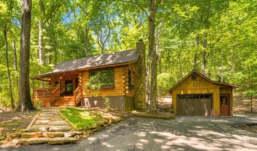 Welcome to 115 Owls Brow! This authentic hand-hewn log cabin is just waiting for it's next chapter.