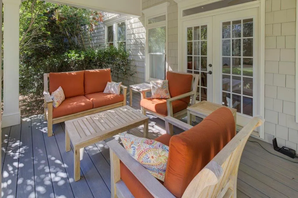 Covered porch with sitting areas.   3 sets double doors to access porch area from living room