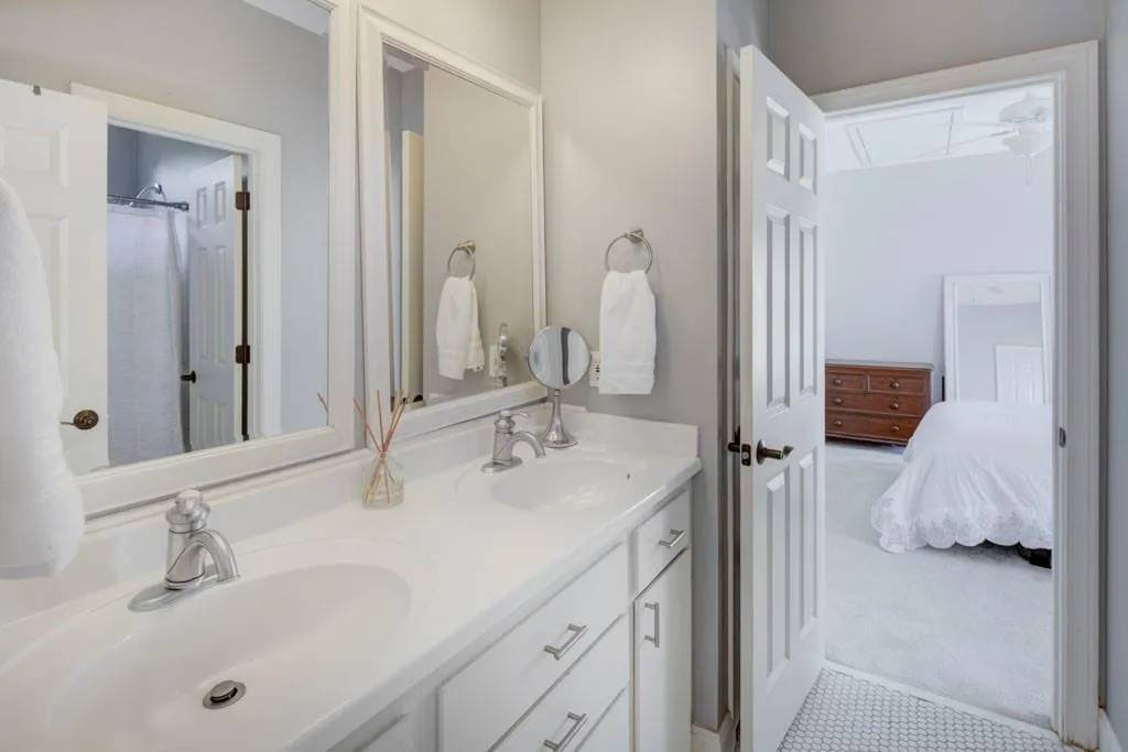 Secondary jack and jill bathroom with double vanities