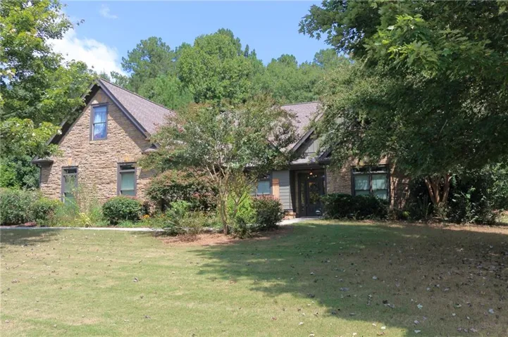 Beautiful curb appeal with Stone facade and dark siding combination