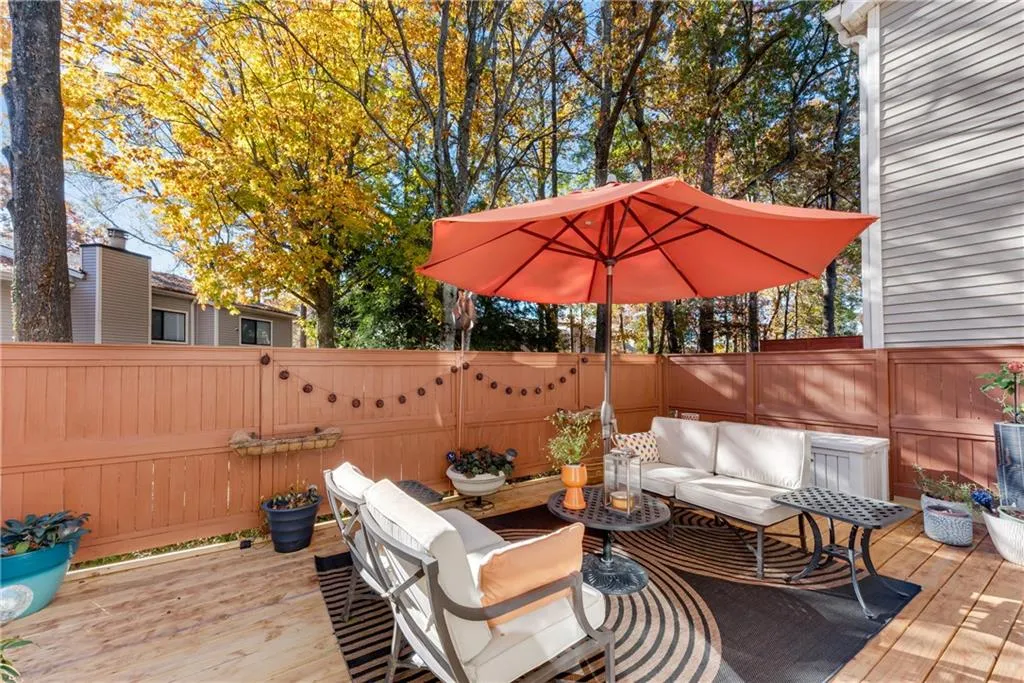 Deck with a fenced backyard and an outdoor living space
