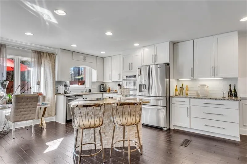 Renovated Island Kitchen open to Family Room & Dining Room.