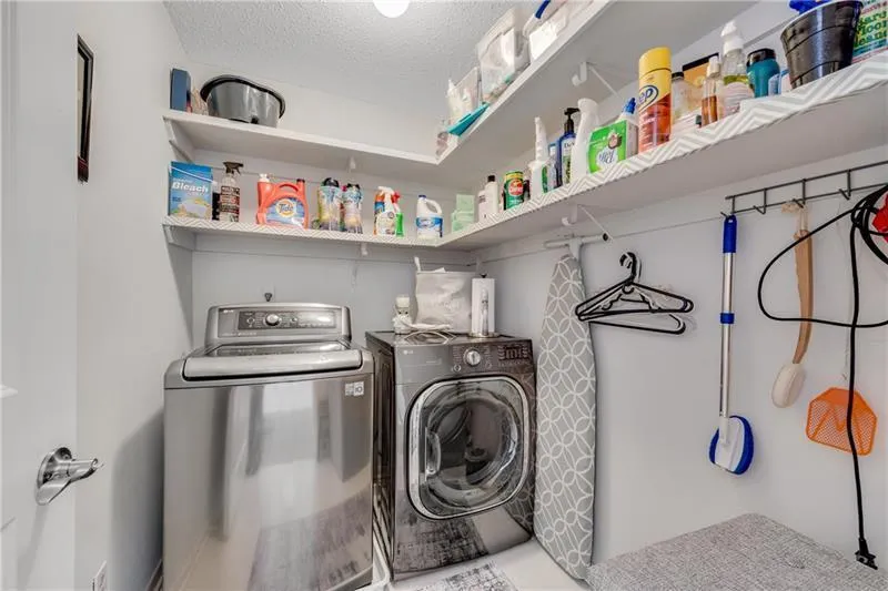 Spacious Laundry Rm is conveniently located on Upper Level, just steps from all BRs.