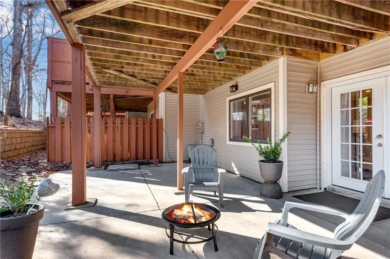 Private Covered Patio of Main Level Bonus Room features Double French Doors.