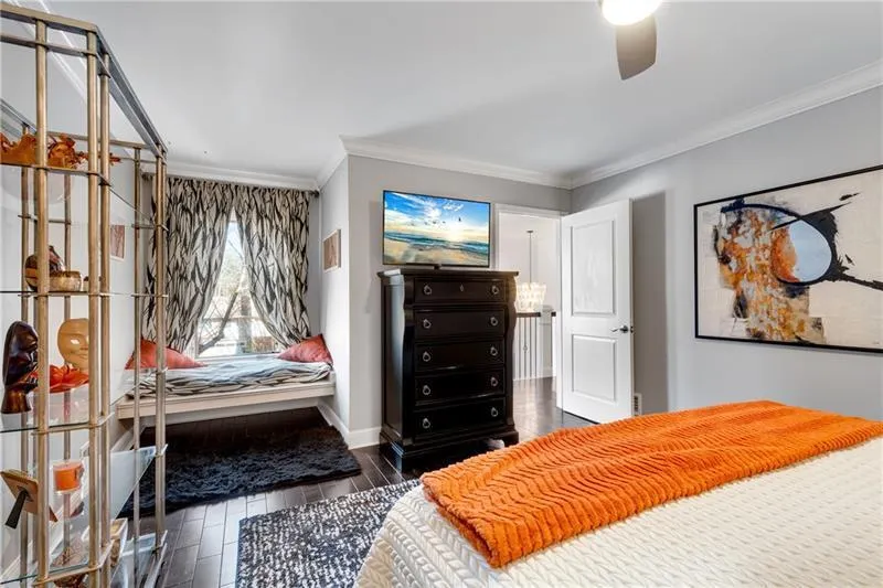View to Hall from Secondary BR with Real Hardwood Floors, Window Seat, Walk-In Closet & Remote-Controlled Ceiling Fan.