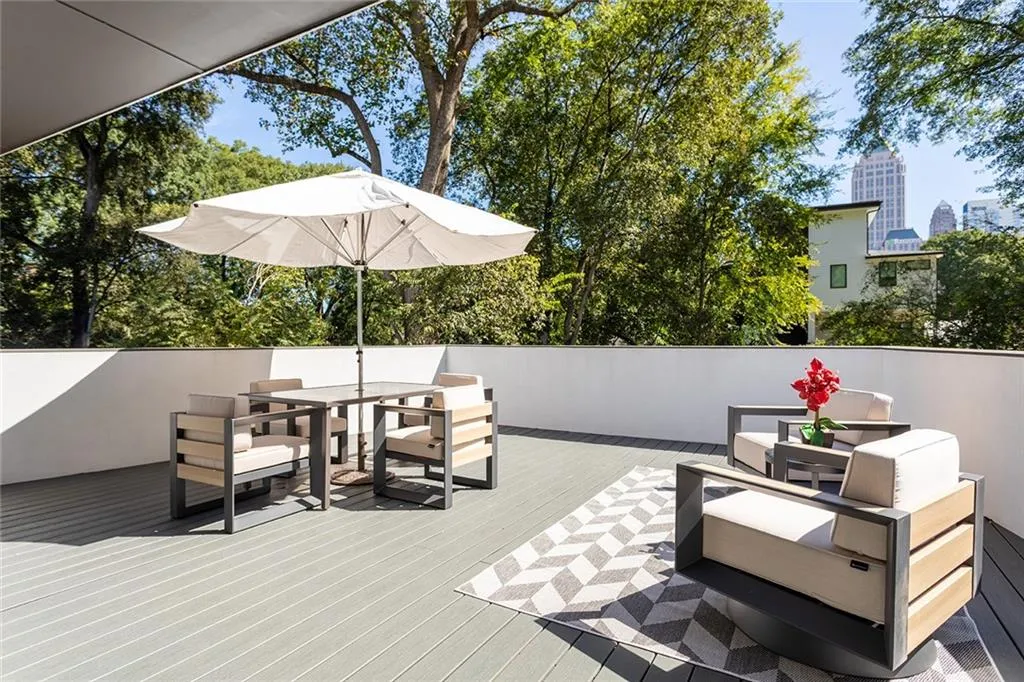 View of patio with an outdoor hangout area, a rooftop deck, and outdoor dining space