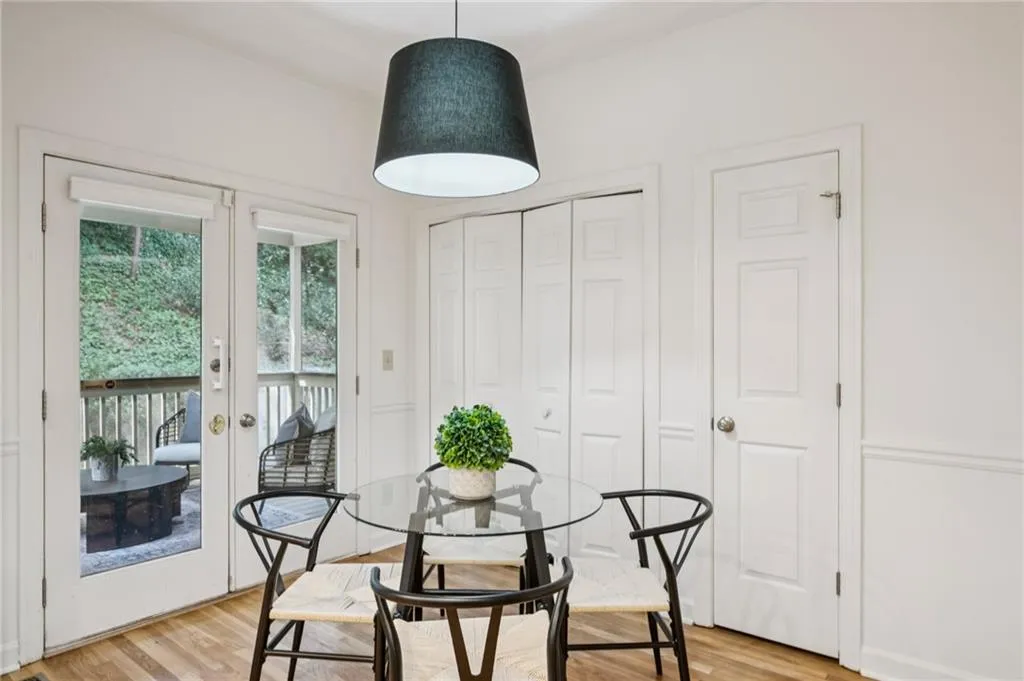 Dining space featuring french doors and light wood-style flooring