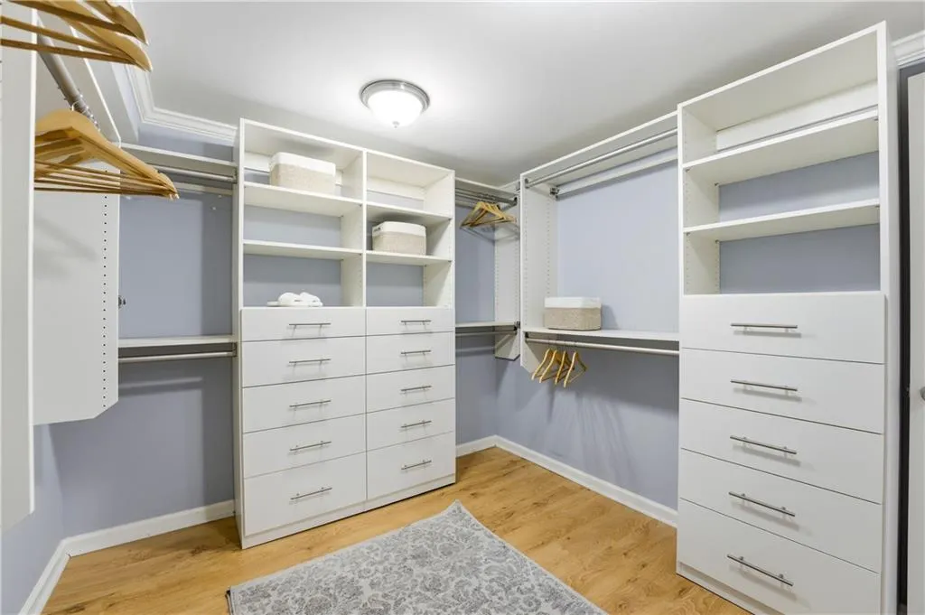 Well-designed closet system with built-in storage comparable to California Closets, offering efficient organization with dedicated space for hanging, shelving, and accessories. A practical upgrade that maximizes usability and keeps the space clean and streamlined.
