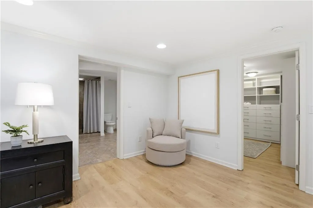 Primary BedroomGenerously sized primary bedroom with hardwood floors, recessed lighting, and multiple windows bringing in natural light. Clean lines and a neutral palette create a calm, comfortable retreat.