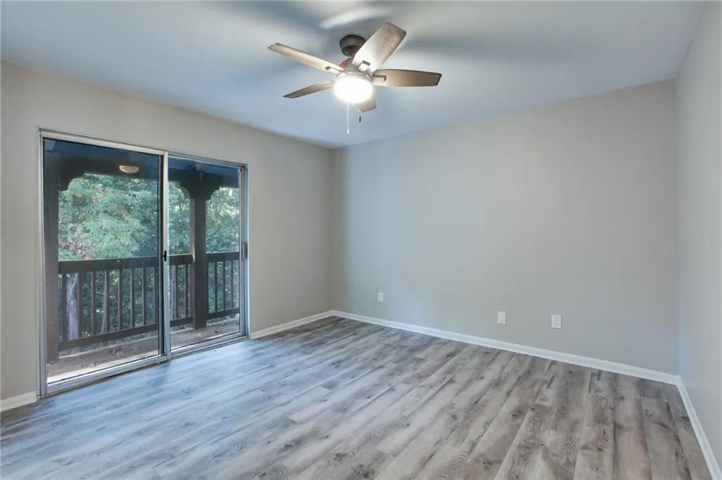 Spare room with light wood-style floors and ceiling fan