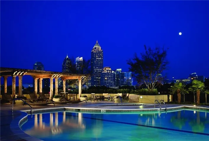 Rooftop swimming pool featuring underwater lighting and a surrounding hardscape