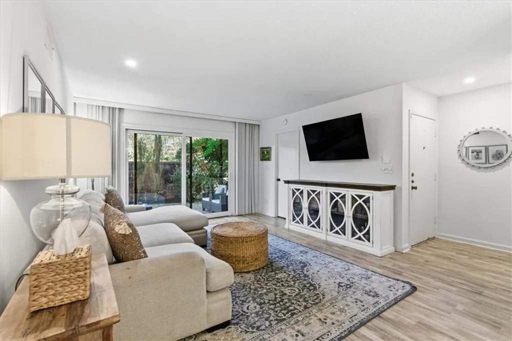 Living room featuring recessed lighting and light wood-type flooring
