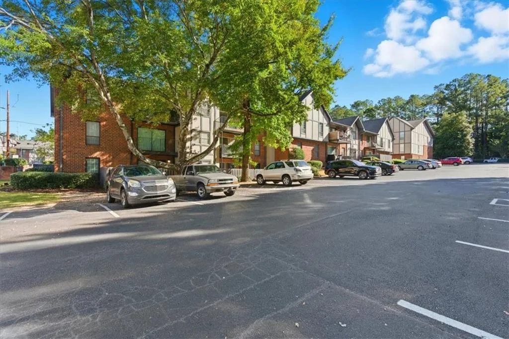 View of asphalt street featuring a residential view