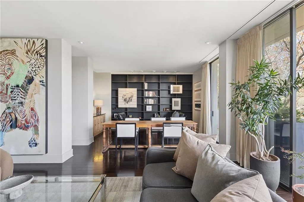 Living area with hardwood / wood-style flooring, a desk, and recessed lighting