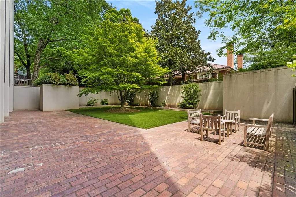 Fenced backyard with a patio