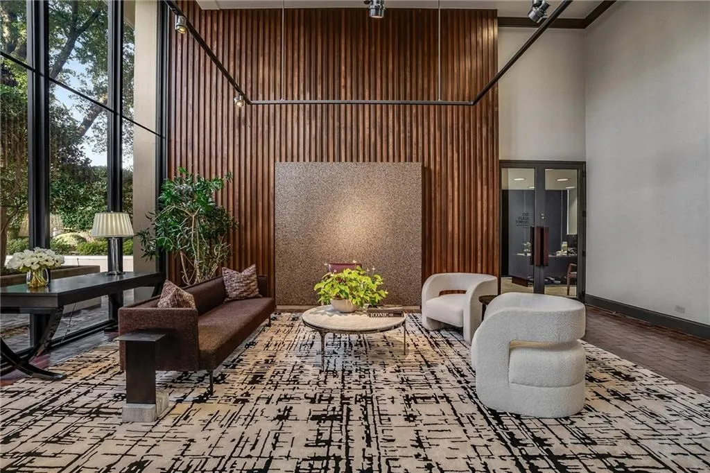 Community lobby with a high ceiling and expansive windows