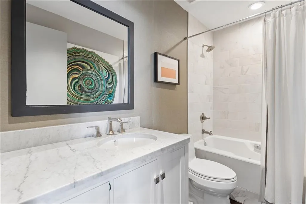 Full bath with vanity and shower / tub combo with curtain