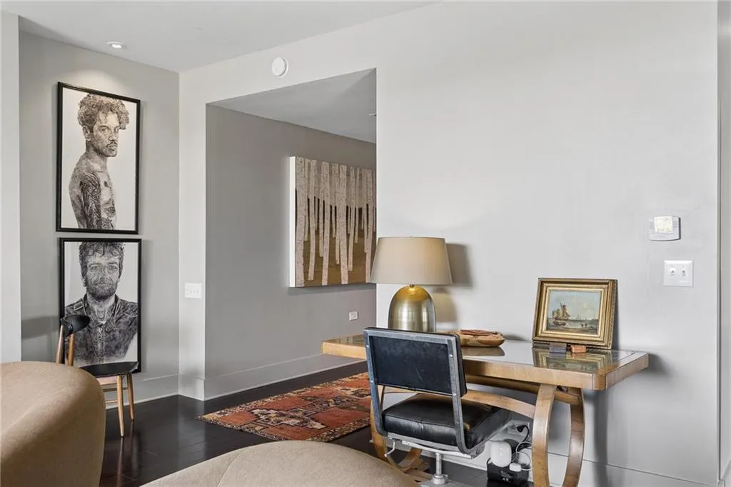 Office with hardwood / wood-style floors and baseboards