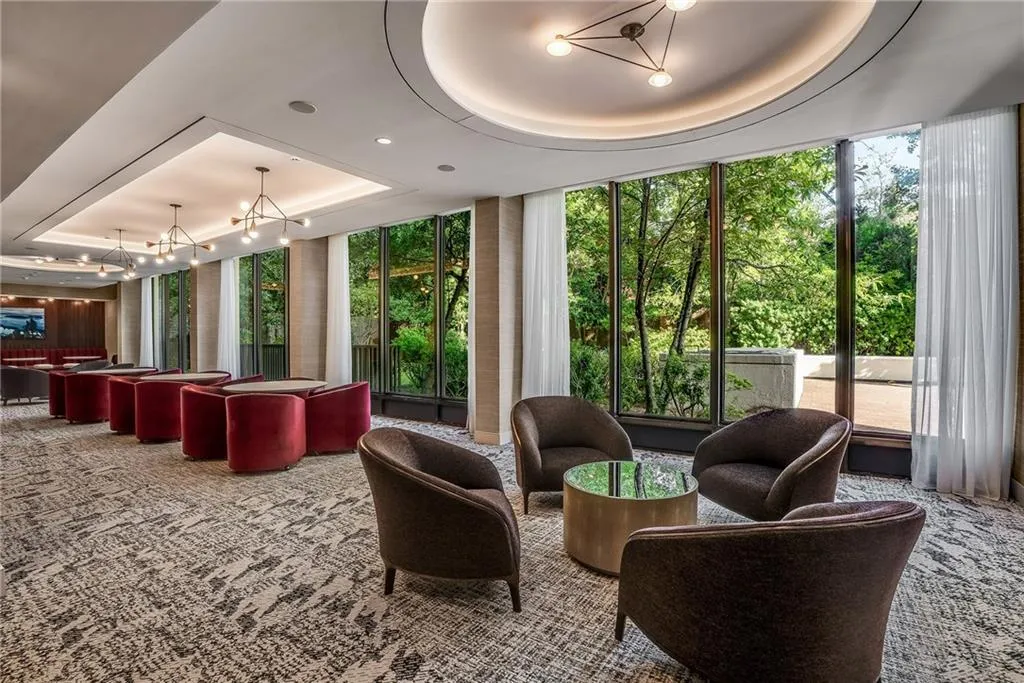Community lobby featuring a tray ceiling