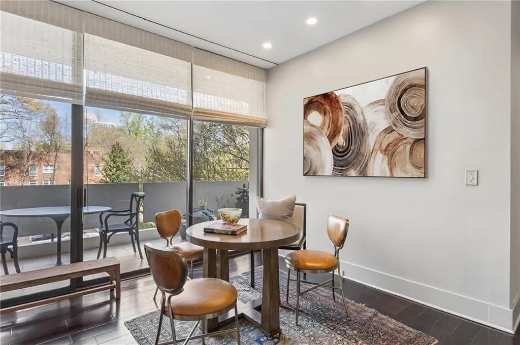 Dining area with hardwood / wood-style flooring, floor to ceiling windows, and recessed lighting