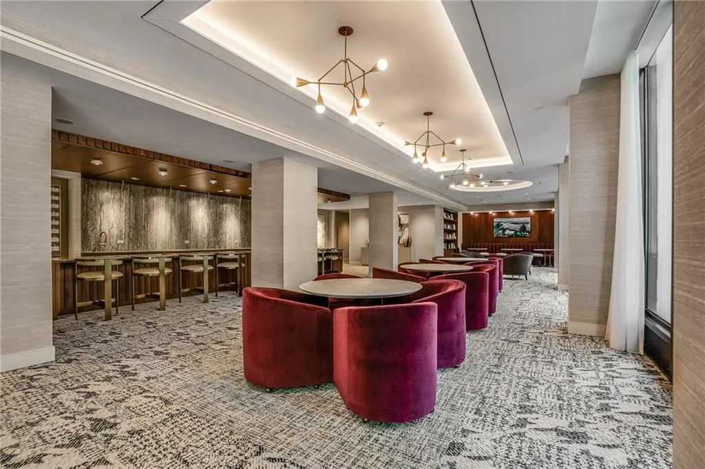 Community lobby featuring a raised ceiling