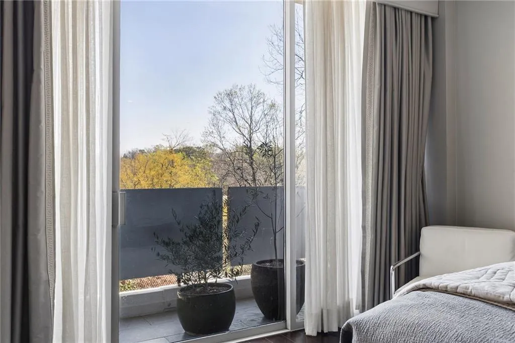 Bedroom with multiple windows