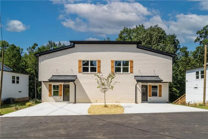 View of front of property with central AC